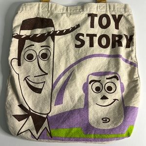 Disney Pixar Toy Story Canvas Tote Bag featuring Woody and Buzz Lightyear.